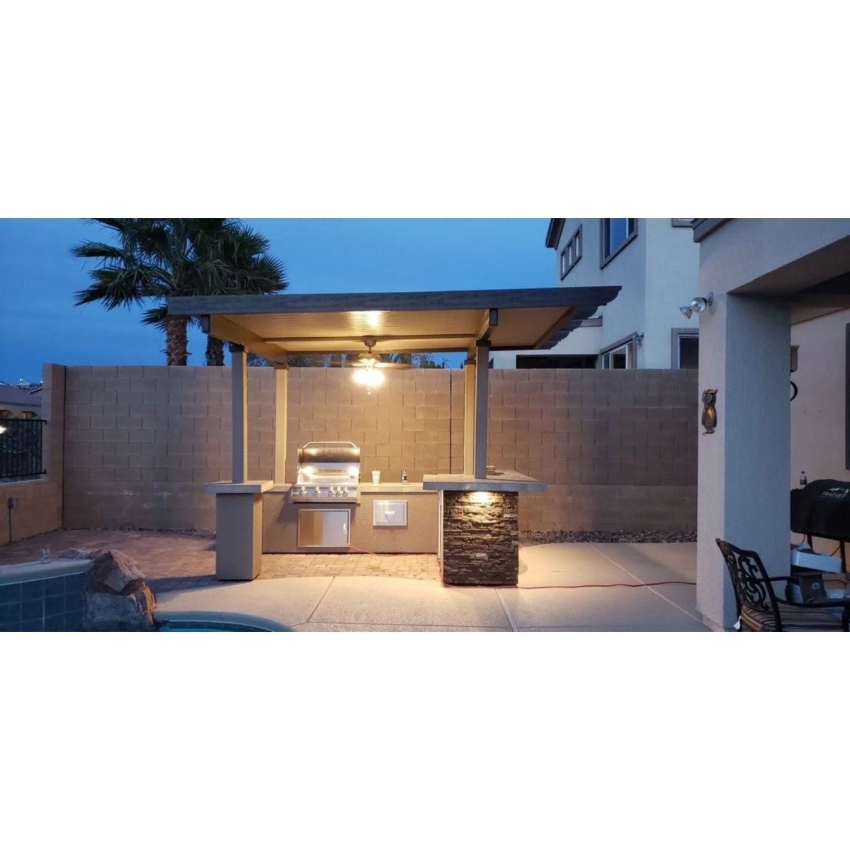 https://upperlivin.com/cdn/shop/products/kokomo-grills-aruba-bbq-island-with-12-x-12-pergola-built-in-bbq-grill-556760.jpg?v=1662638671